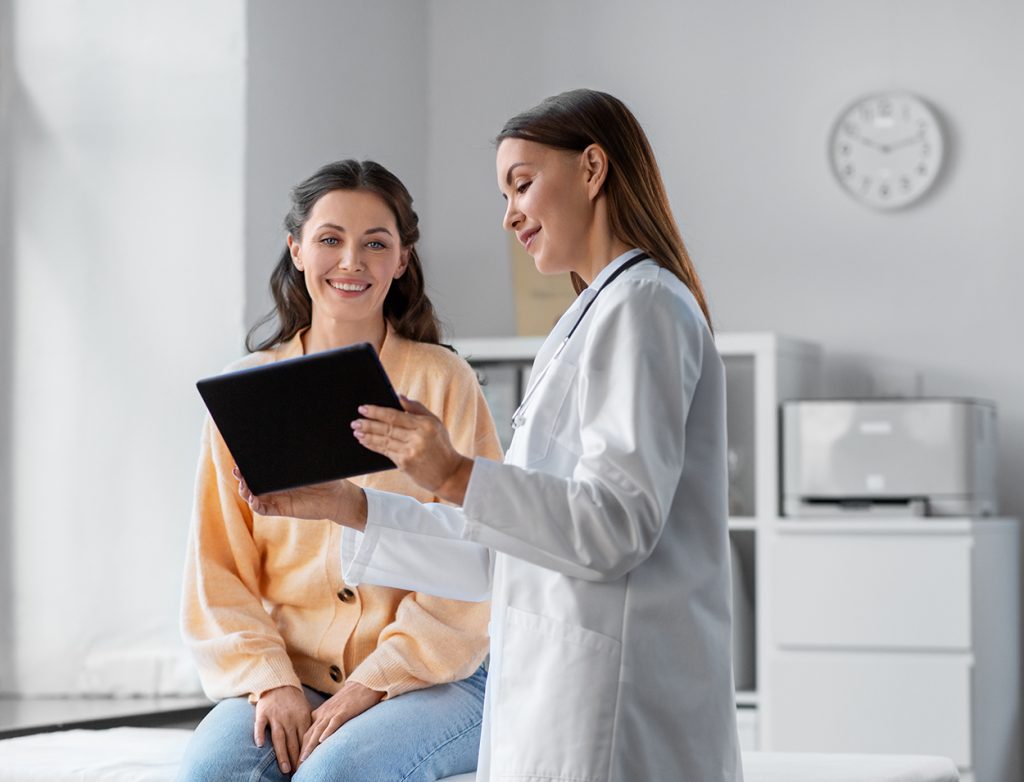Doctor checking female patient