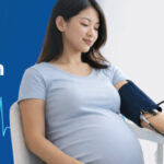 pregnant woman having blood pressure checked during prenatal visit