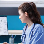 doctor comparing biosimilars and biologics treatment options on digital interface