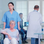 nursing shortage impact showing nurse managing multiple patients in hospital