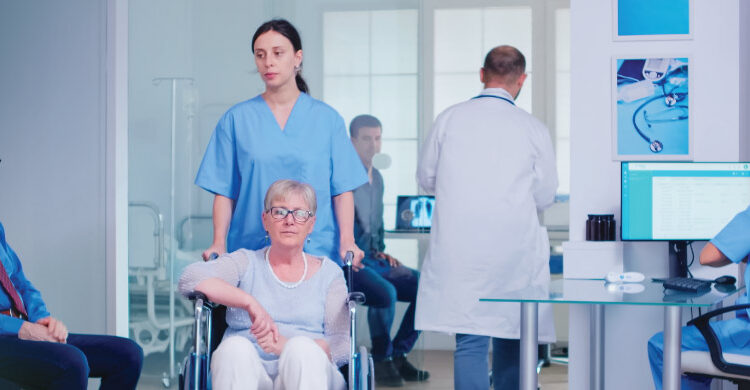nursing shortage impact showing nurse managing multiple patients in hospital