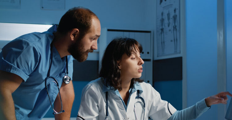 healthcare professional working on laptop exploring side hustles for healthcare professionals