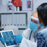 technology in nursing showing nurse using digital system for patient care