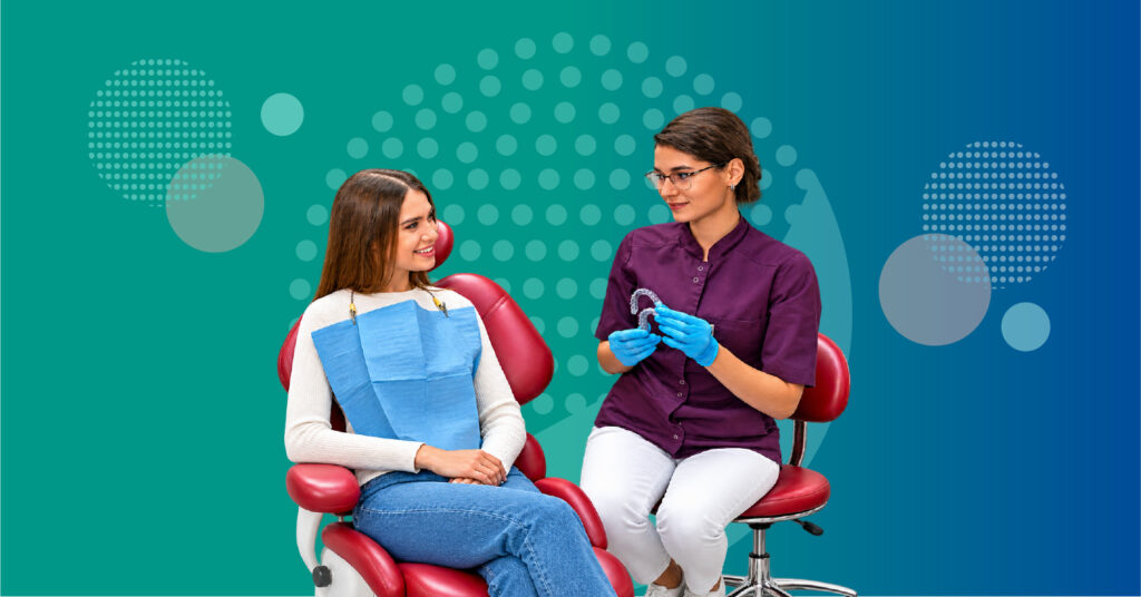 dentist reviewing clear aligner treatment progress digital tooth movement and tray tracking with an adult orthodontic patient